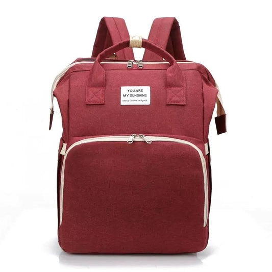 Mochila pañalera con estación de cambio