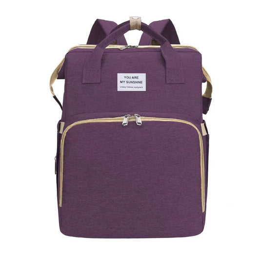 Mochila pañalera con estación de cambio